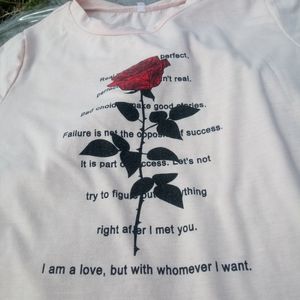 pink shirt with rose and words